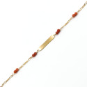Bracciale in oro giallo con targhetta e corallo