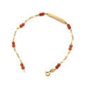 Bracciale in oro giallo con targhetta e corallo