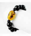 Bracciale elastico con sfere nere e particolare ambra