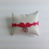 BRACCIALETTO CON CIONDOLO ROSA COLORE FUCSIA