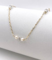 Collana in oro giallo con perle e sfere zirconate