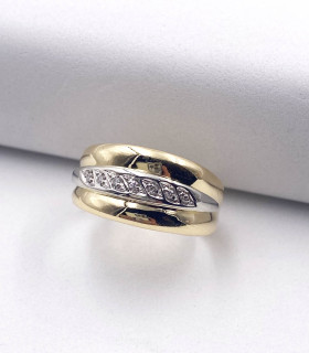 Anello in oro giallo e oro bianco a fascia con brillanti carati totali 0,07