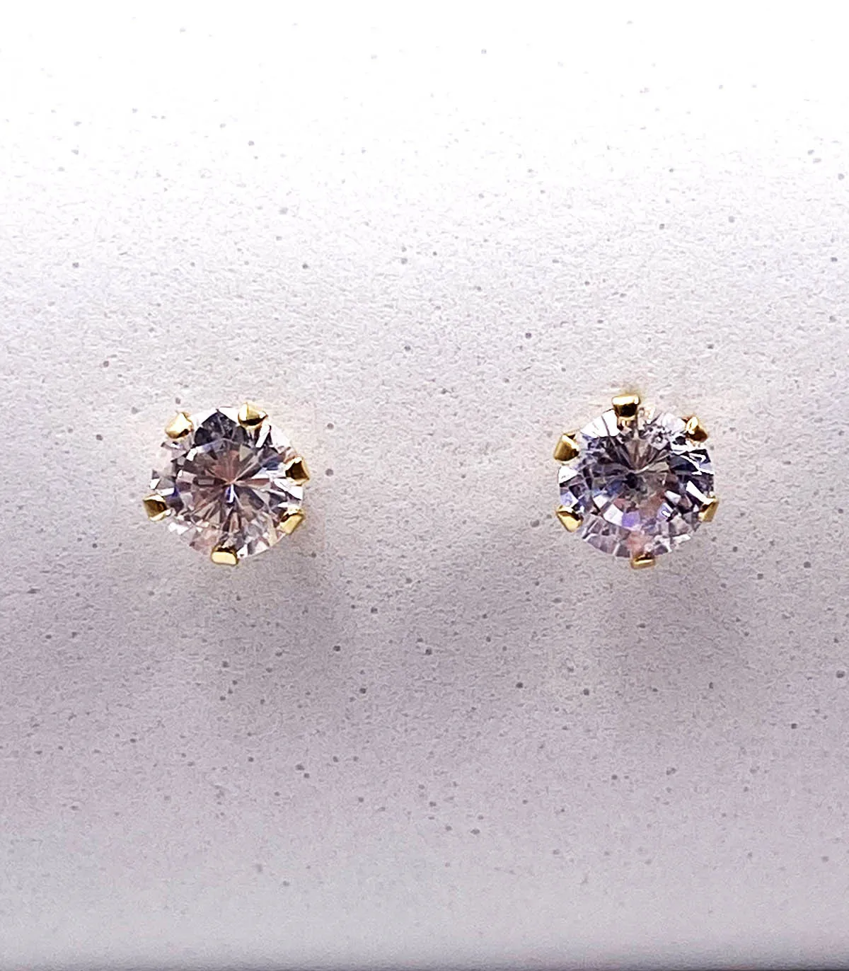 Orecchini punto luce in oro giallo con zirconi