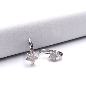 Orecchini in oro bianco a monachina con stella