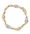 Bracciale in oro giallo con maglie in oro bianco