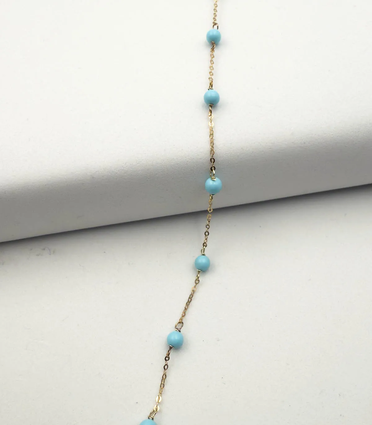 Bracciale in oro giallo con corallini turchesi