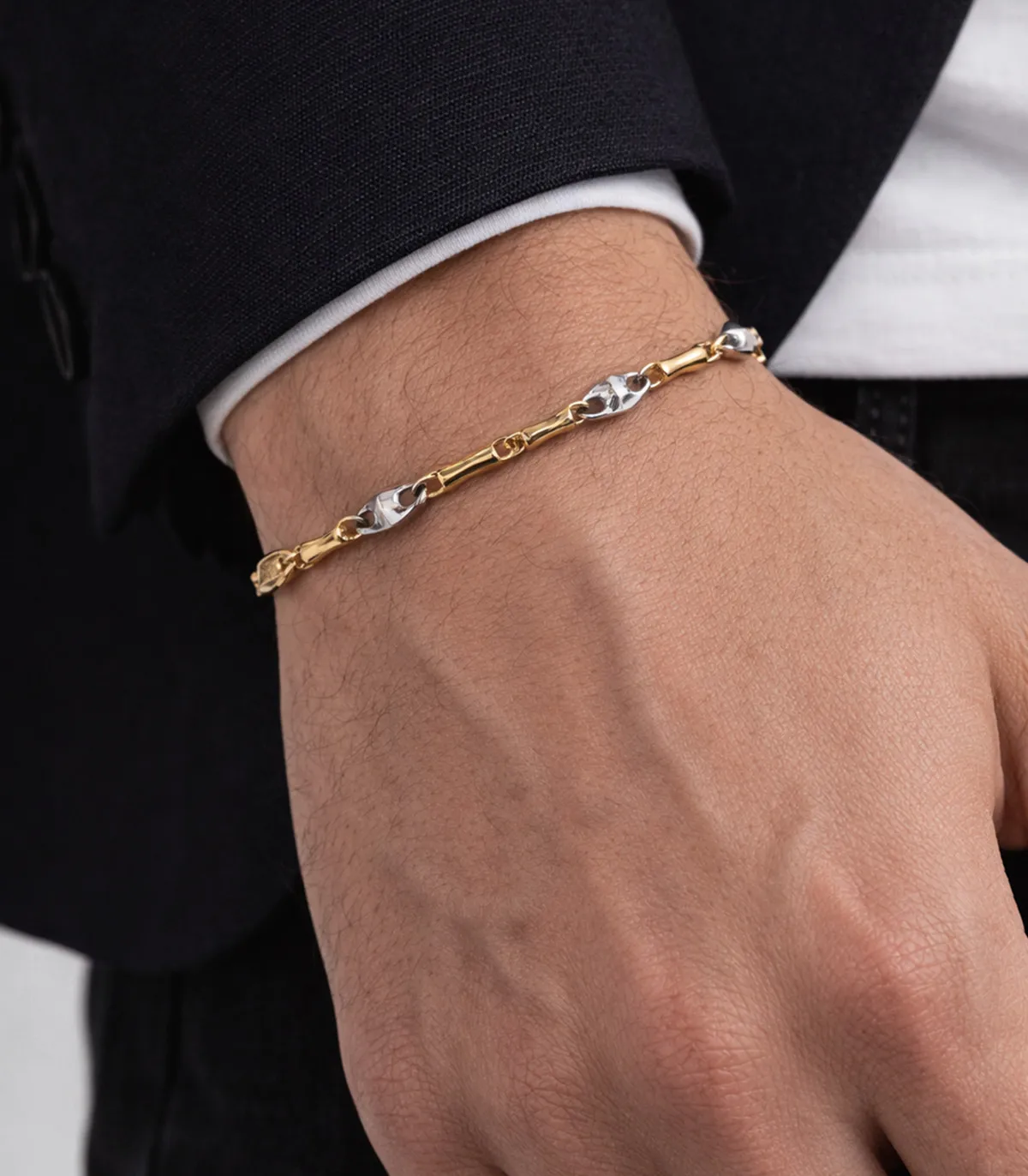 Bracciale in oro giallo con particolari in oro bianco